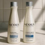 Nexxus shampoo and conditioner bottles on marble counter